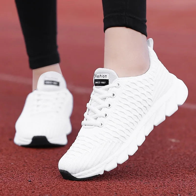 Women's running shoes with fly weaving upper in black, pink, or white colours showing breathable construction