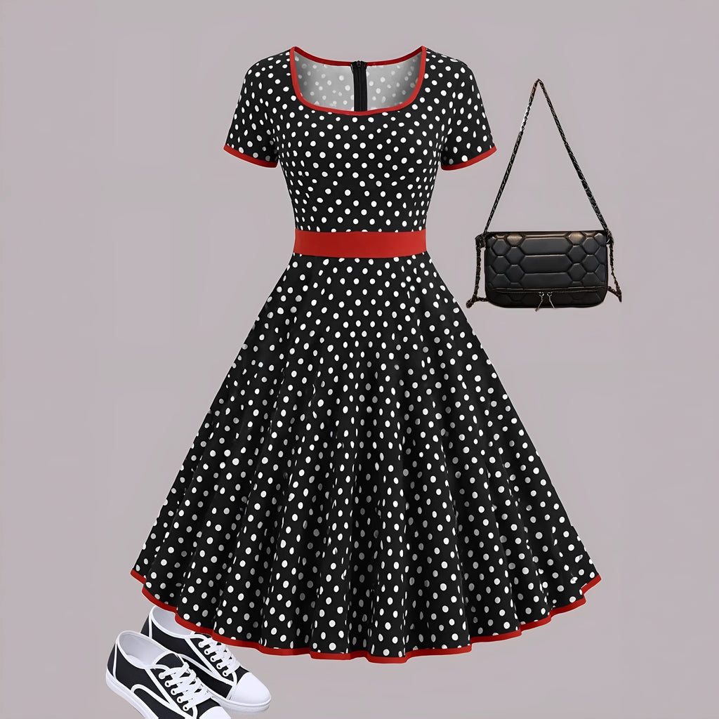 Women's multicolour polka dot pleated dress with a square collar, short sleeves, and a front zip fastener.
