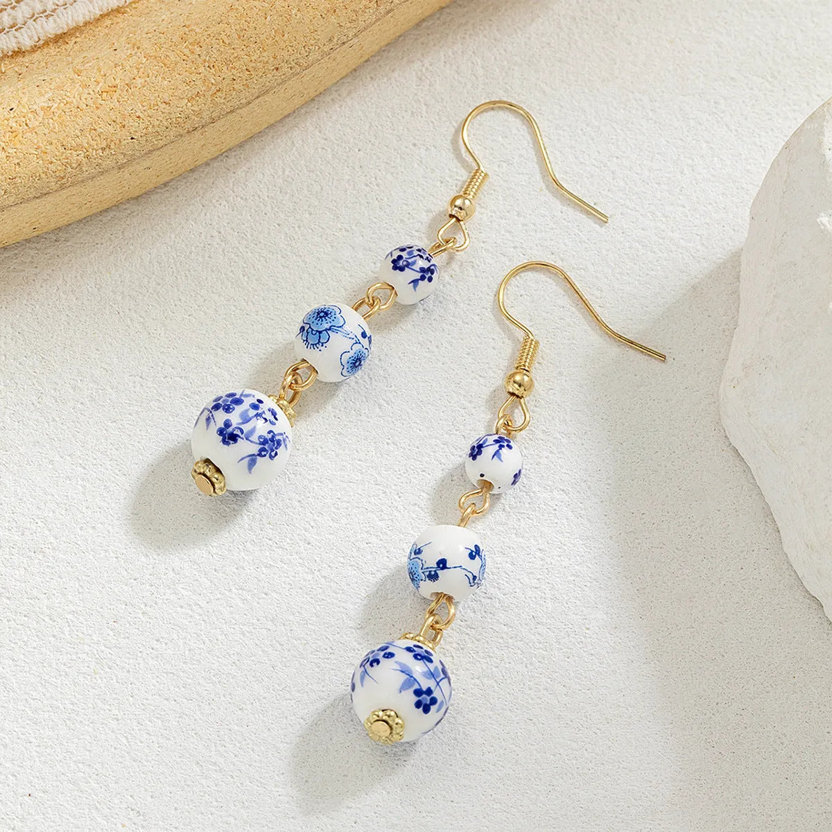 Blue and white porcelain ceramic bead earrings with geometric alloy elements in Chinese style design