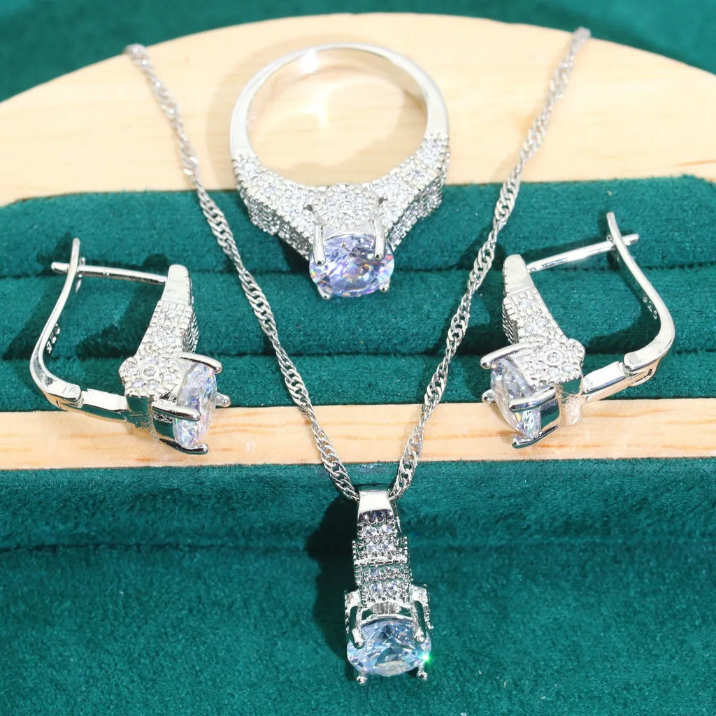 Bridal zircon jewellery set showing necklace, earrings, bracelet, and ring pieces with water wave chain design