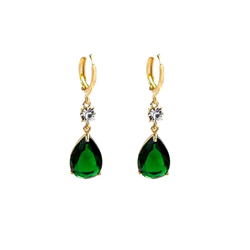 A pair of geometric green teardrop-shaped alloy drop earrings on a white background.