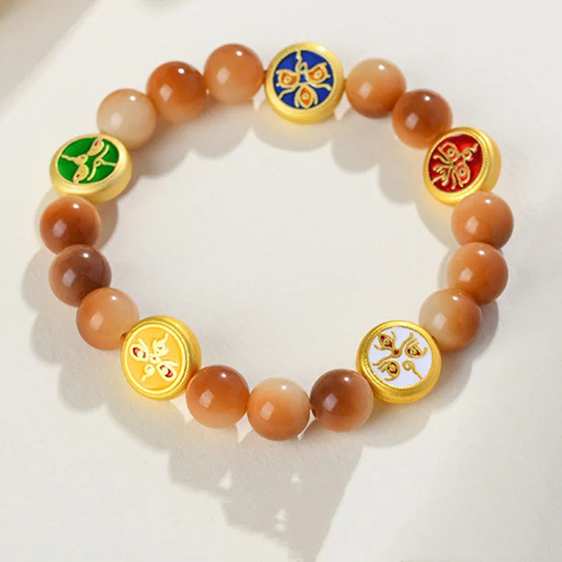 Yellow bodhi seed bracelet with five directions pattern and round geometric design
