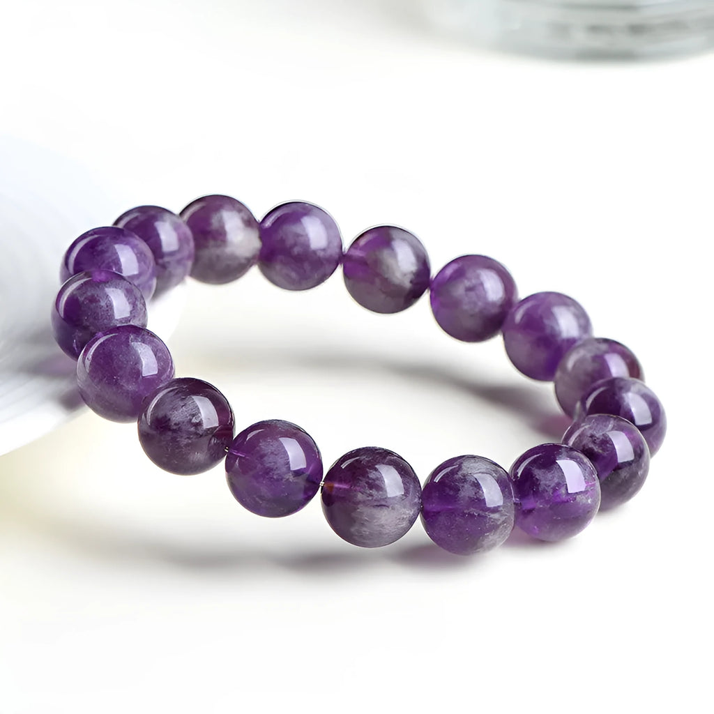 Natural feather amethyst bracelet in Snow Mountain Purple with scattered beads and Ruyi symbol