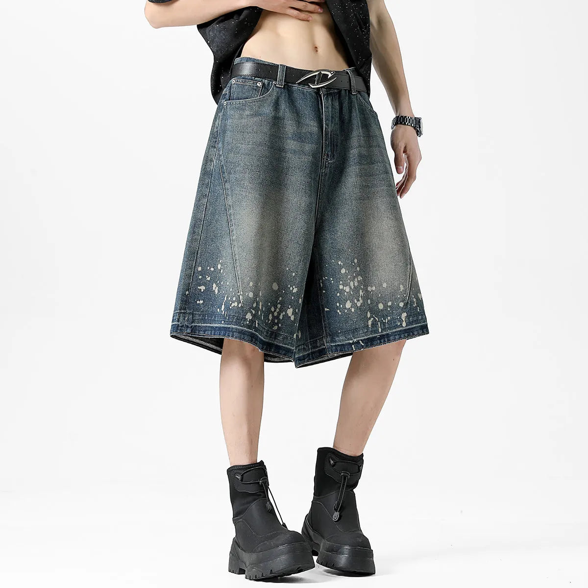 Men's retro blue denim shorts with ripped details, splash ink design, and five-point star decorations on a straight-leg cut.