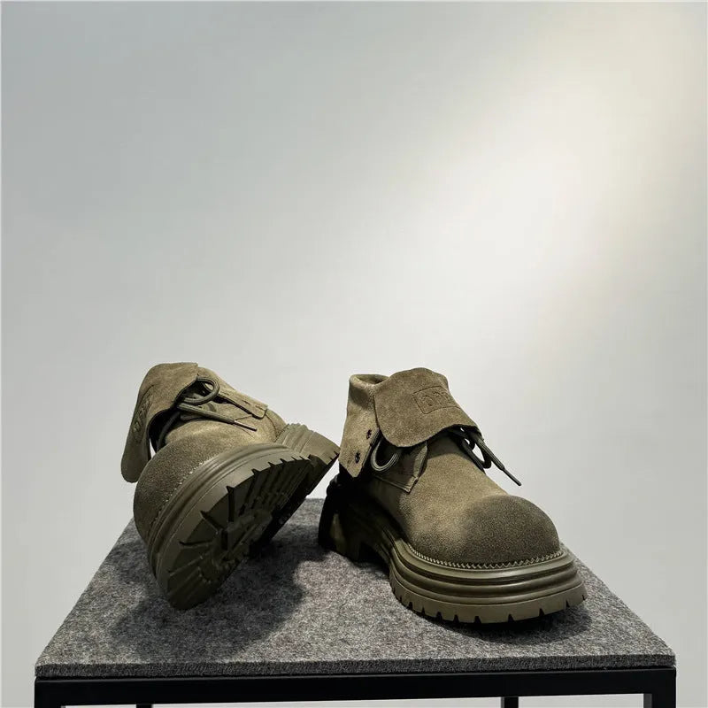 Distressed cow suede worker boots with thick soles and retro sewing detail in camel colour