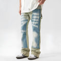 Yellow and blue retro patchwork jeans with splash-ink damaged design on denim