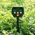 Green solar ultrasonic animal repeller with solar panel on top for outdoor pest control