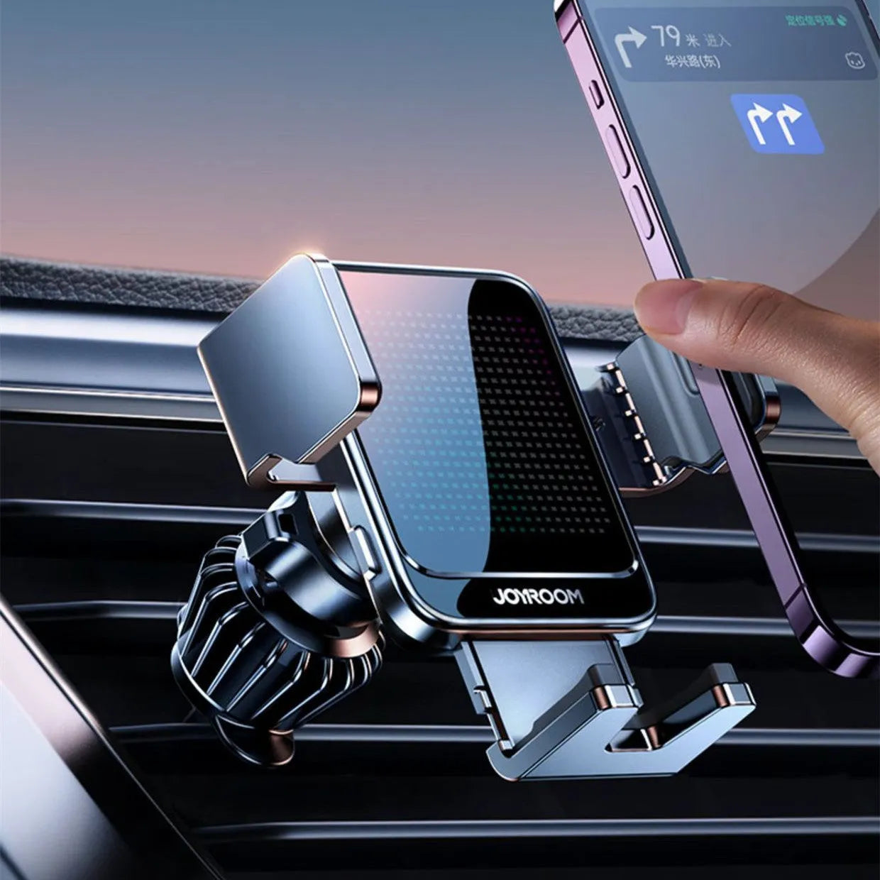 Black car air vent wireless phone charging bracket with automatic arms, shown with a mobile phone.