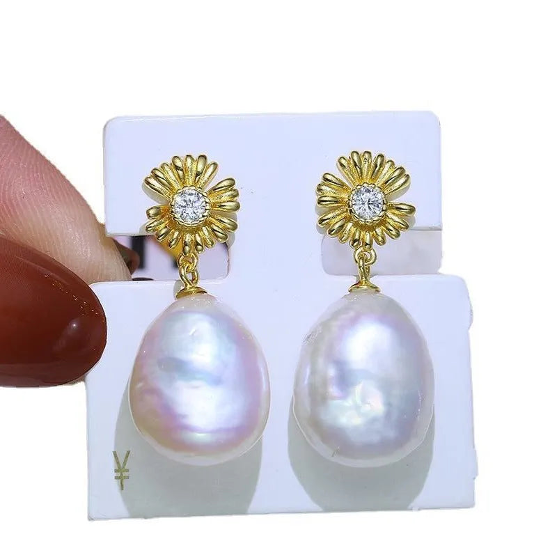 Baroque flower-shaped S925 sterling silver earring frames and a ring holder on a plain background.