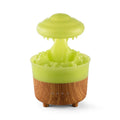 Wood grain white cloud-shaped humidifier and essential oil diffuser with coloured LED night light on a table.
