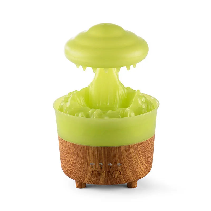 Wood grain white cloud-shaped humidifier and essential oil diffuser with coloured LED night light on a table.