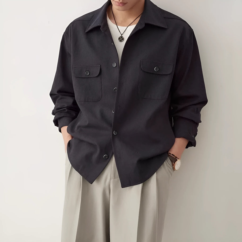 Men's light sand rice cotton lapel long sleeve shirt on a hanger.