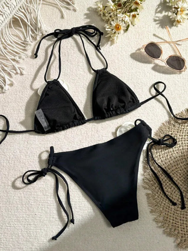 Black women's bikini swimsuit with 3D flower lace detailing and backless split design