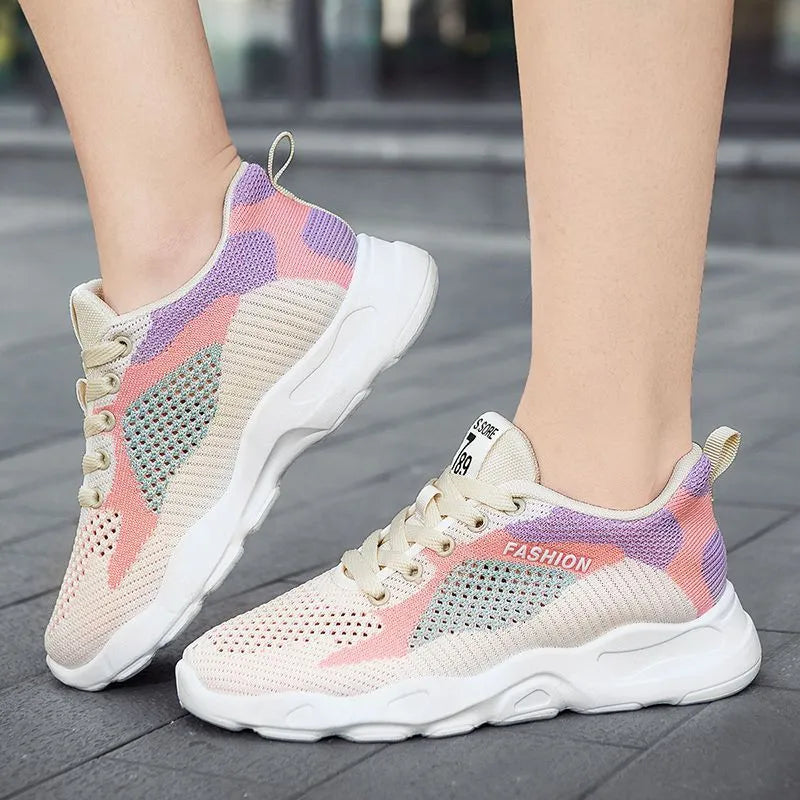 Casual colourblock lace-up sneakers for women with blue mesh upper, round toe, and white sole on a light background