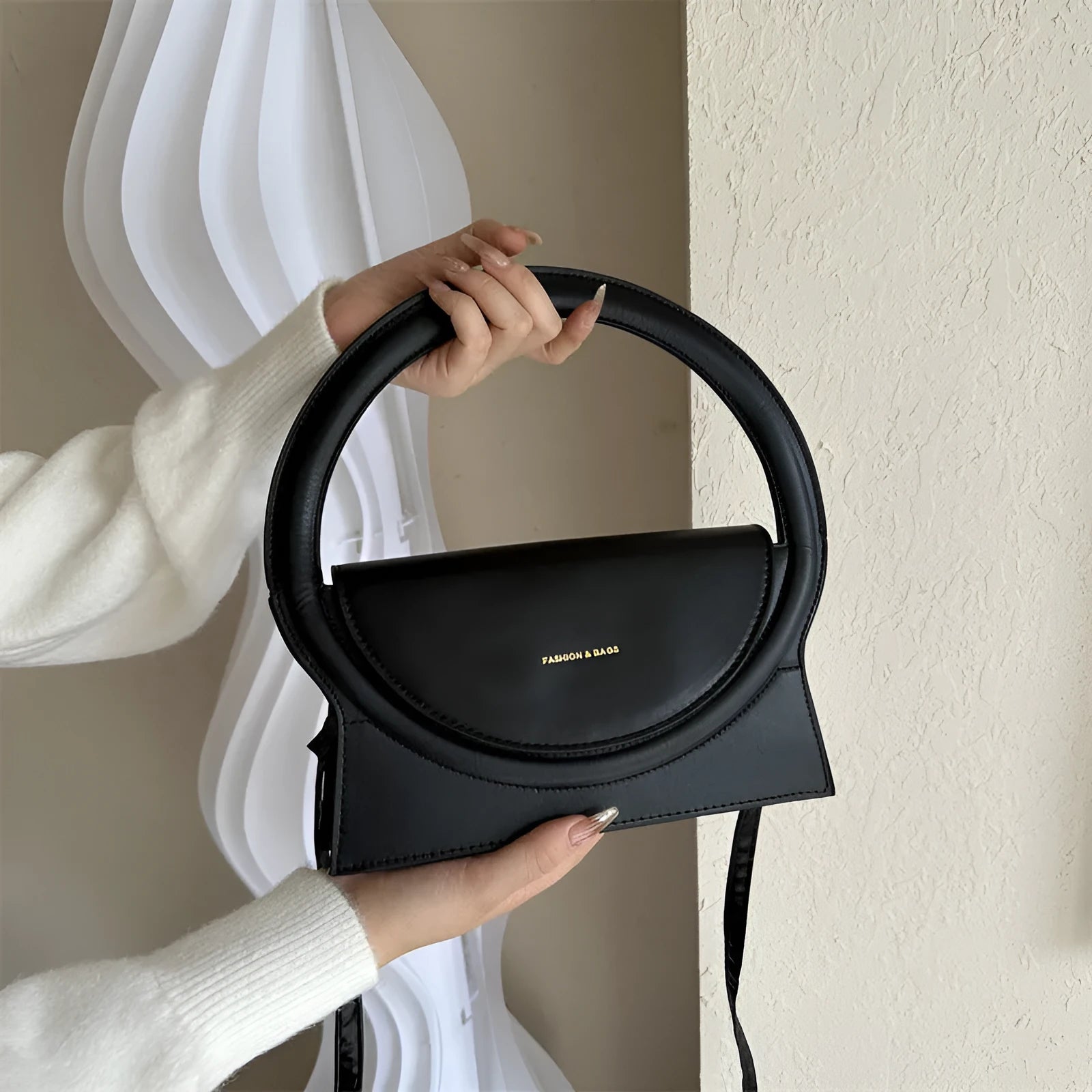 Horizontal square messenger bag in multiple colours showing stitching details and shoulder strap