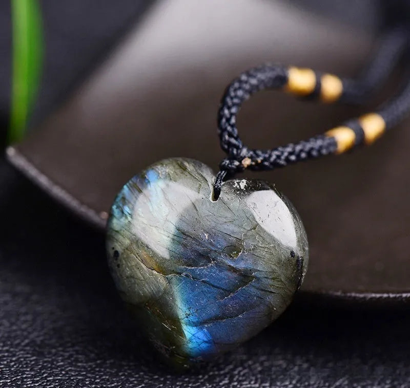 Natural labradorite moonstone crystal necklace with geometric blue pendant on a silver chain.