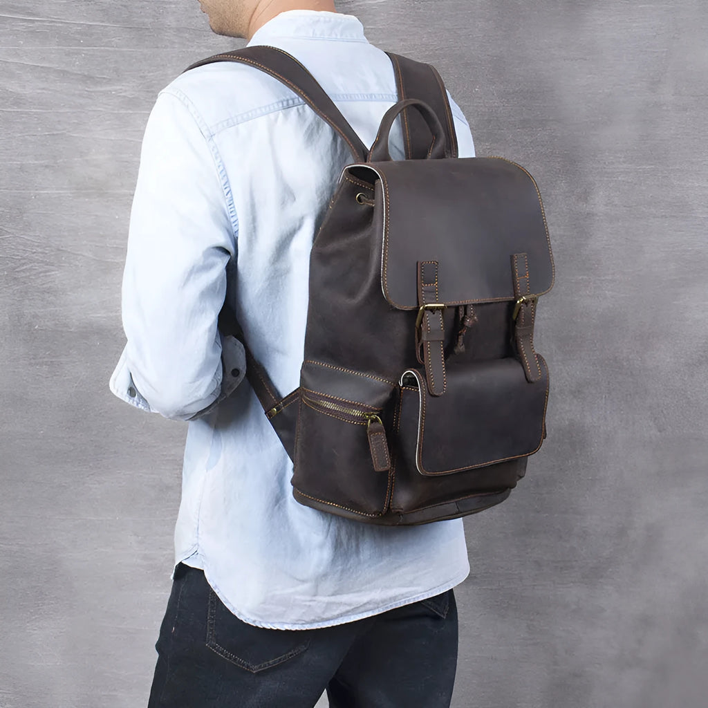 Retro brown leather backpack with double shoulder straps and vintage styling