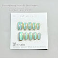 Set of electroplated Cat's Eye false nails with Aurora armour style in short ladder almond shape.