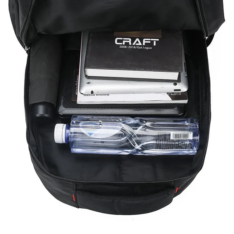 Men's large capacity nylon backpack in grey colour with curved shoulder straps and letter detailing