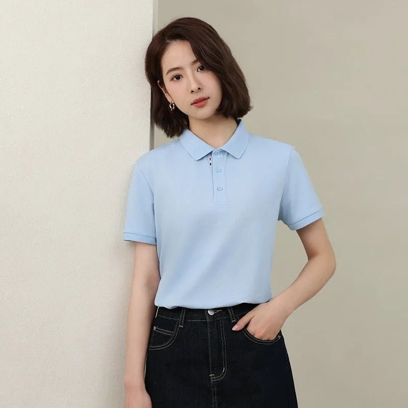 Solid colour short sleeve catering work polo shirt on a hanger, available in multiple colours and sizes.