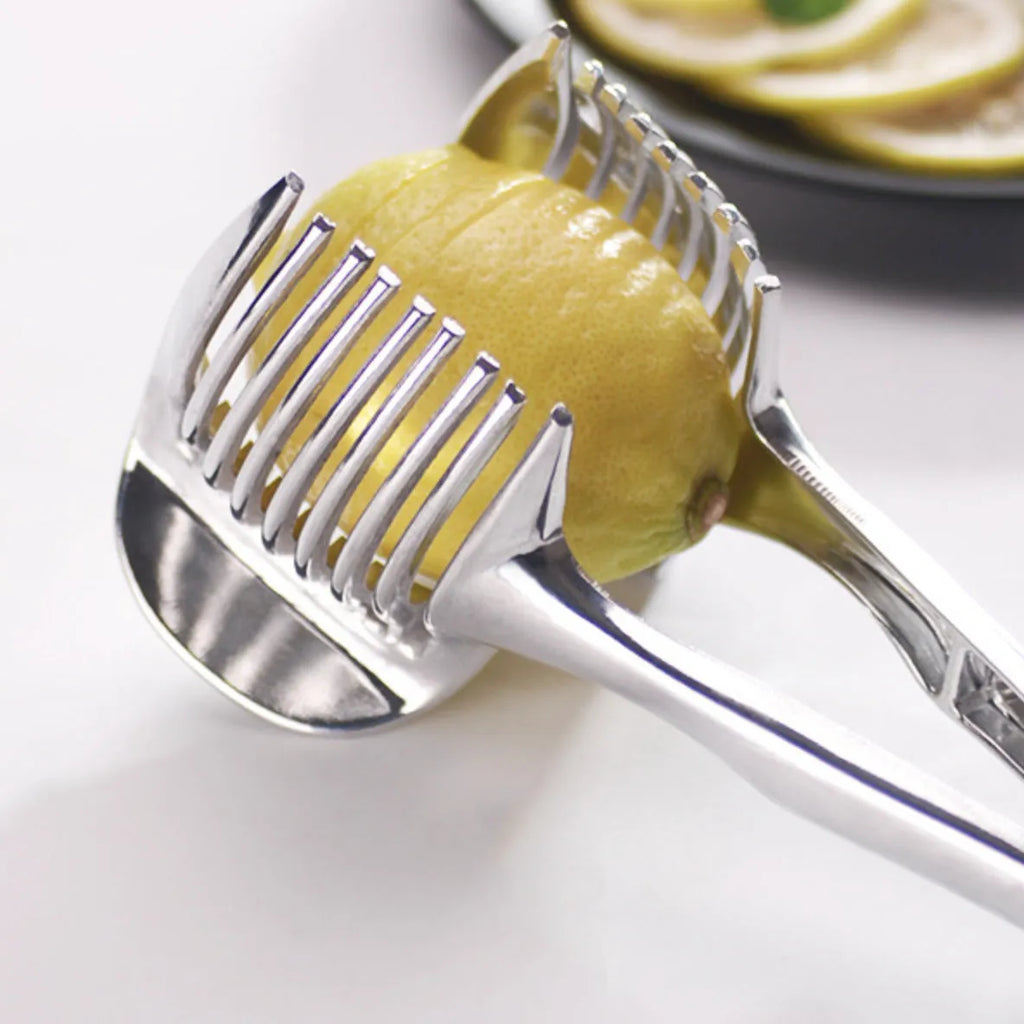 Silver plastic lemon slicer kitchen gadget with ergonomic handles for cutting citrus fruits