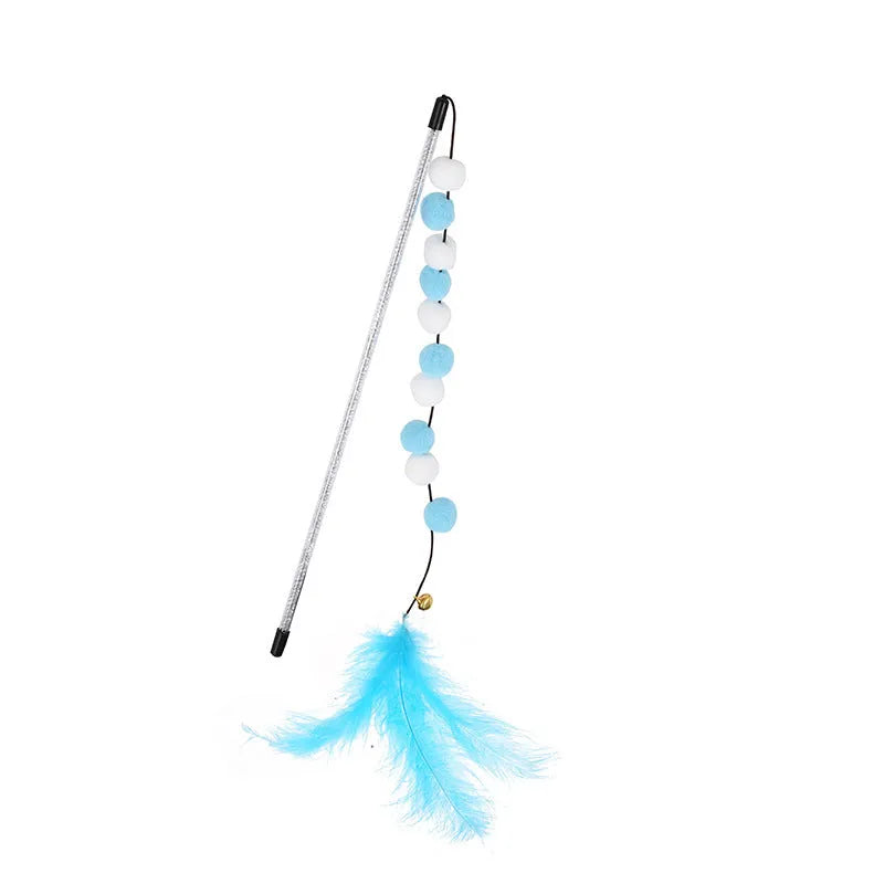 Grey, yellow, and blue acrylic pompon cat teaser stick with feather and bell, shown at 31cm length.