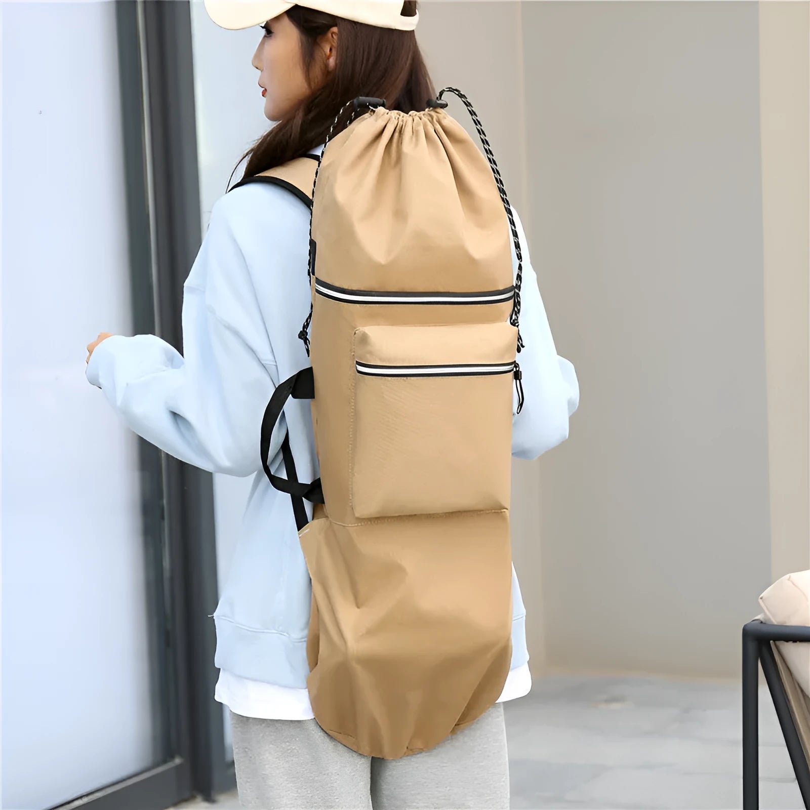 Lightweight nylon skate bag in black, open to show large 20-35 litre capacity.