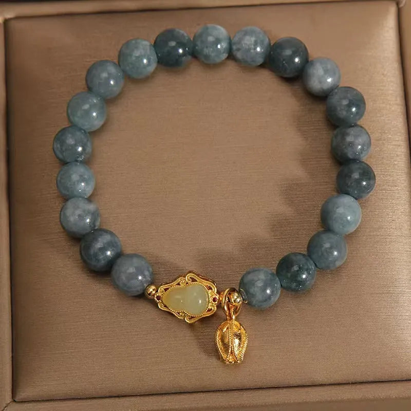 Women's natural stone bracelet with lotus flower gourd pendant in sky blue colour
