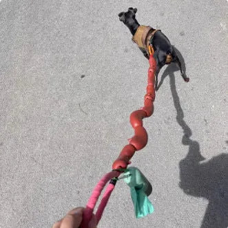 Brown sausage-link dog hand rope toy with grip tape, total length 108cm.