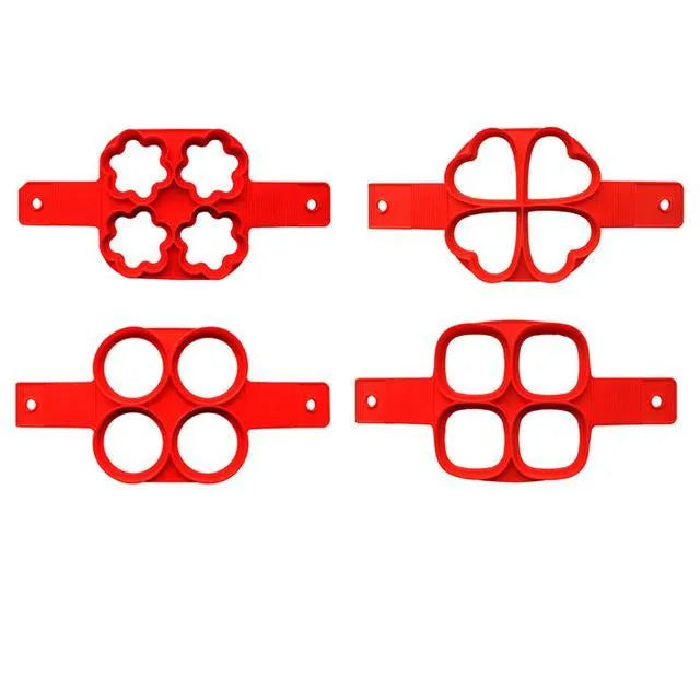 Red silicone non-stick egg ring mould for making round pancakes on a frying pan