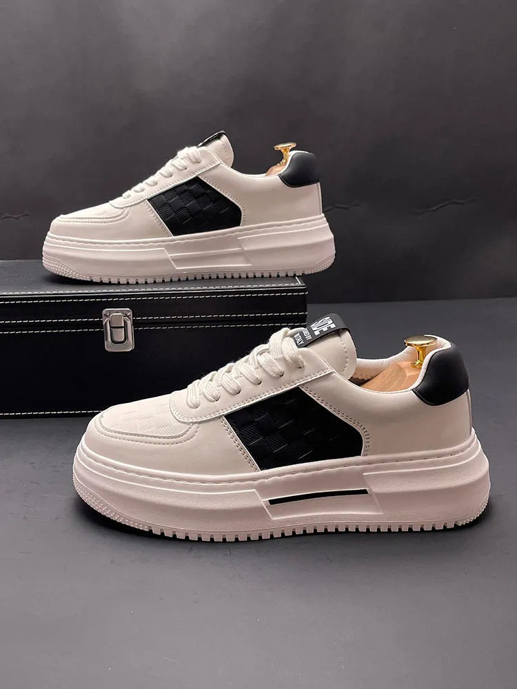 A pair of white and green casual shoes with a cloth upper and rubber foam sole, shown on a plain background.