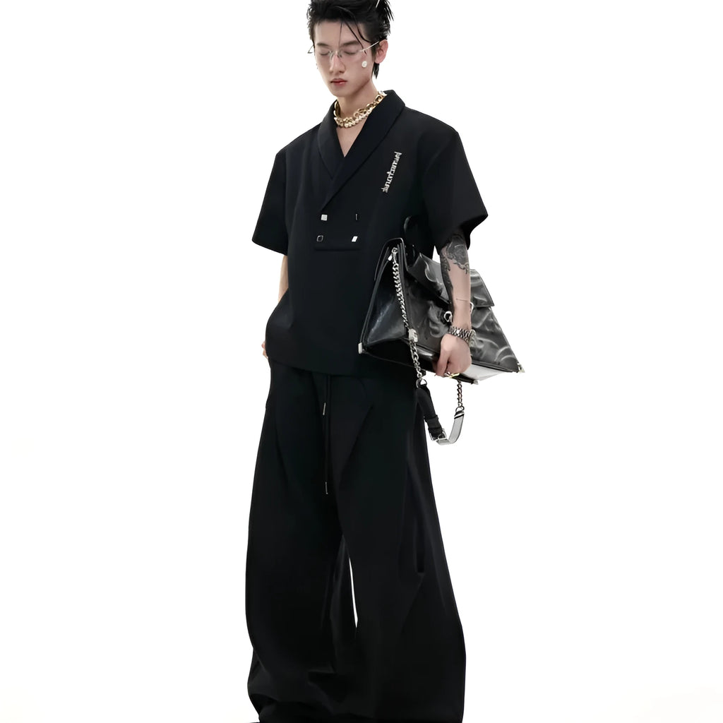 Man wearing a dark grey V-neck padded shoulder short sleeve jacket and matching shorts, a cotton sports suit set.