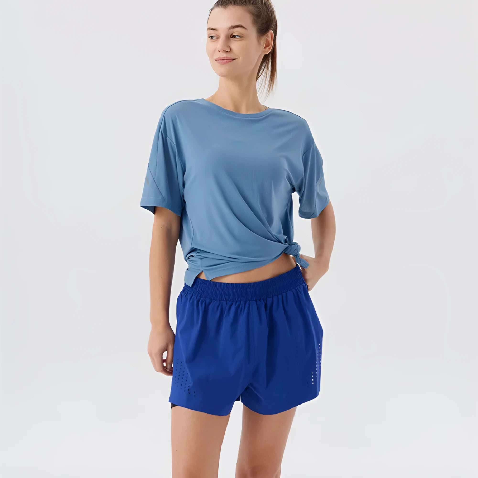 Men's straight-leg sports shorts with side slits in turmeric yellow colour, showing athletic design with micro elastic nylon fabric
