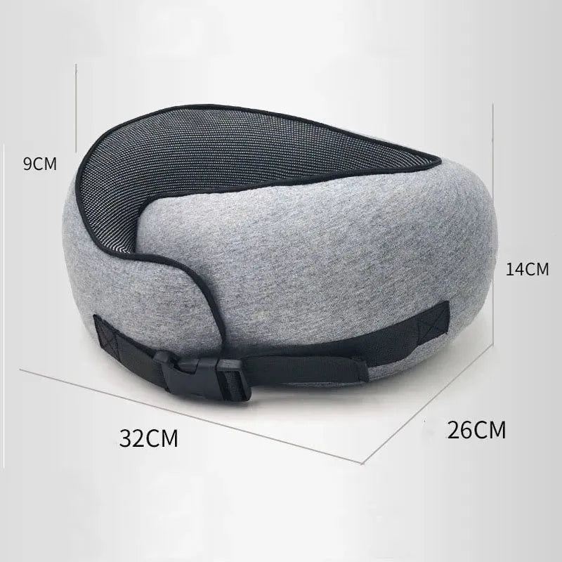 U-shaped memory foam travel neck pillow in navy blue with buckle fastening, shown rolled with carry bag