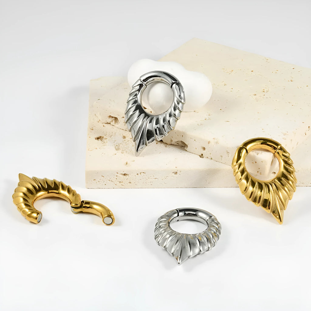 Drop-shaped stainless steel ear extender with totem patterning in silver finish