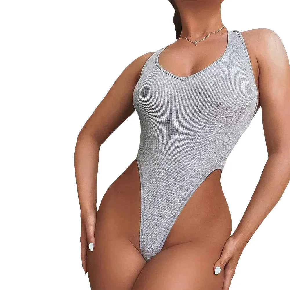 Grey women's halter jumpsuit with suspenders vest styling and shorts-length legs