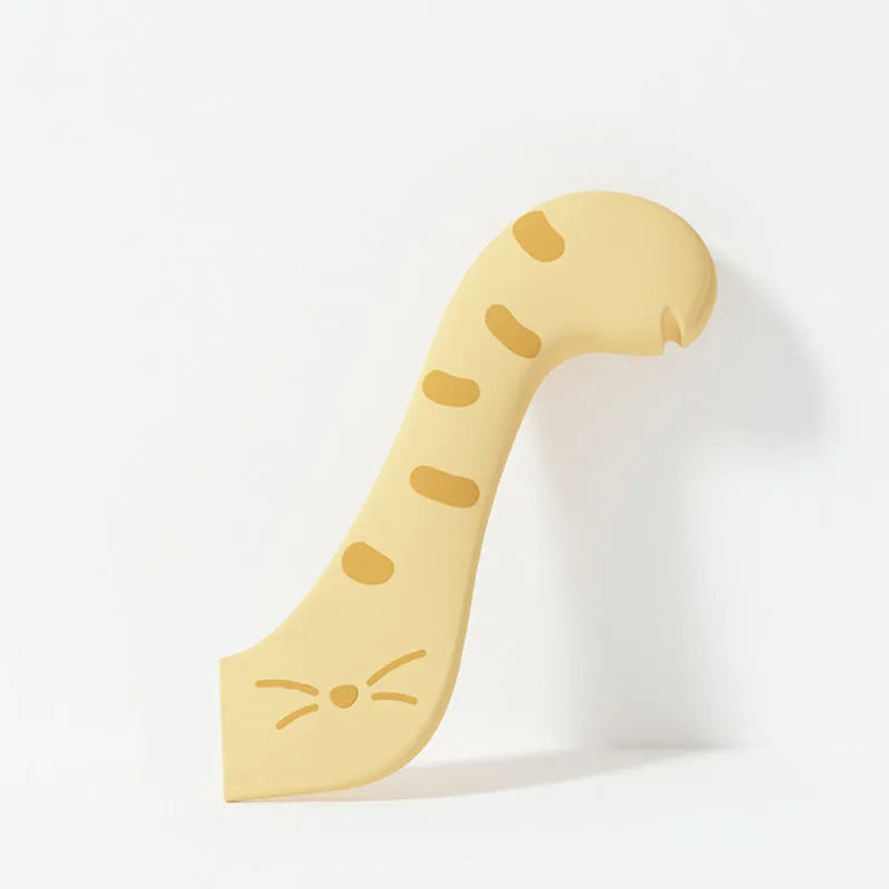 Grey silicone pet food can sealing lid and mixing spoon with integrated can opener on a white background.