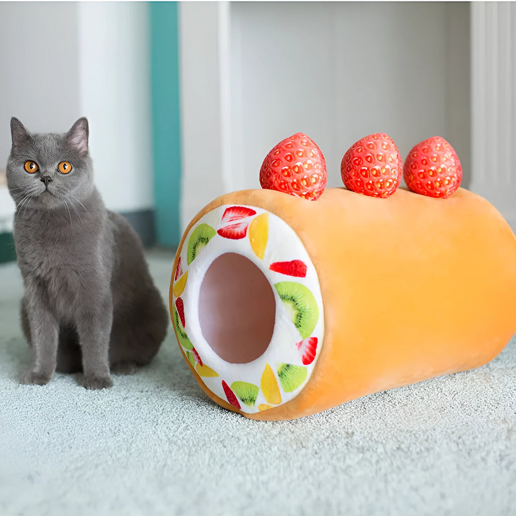 Yellow cake roll plush cat toy 40cm long on plain background