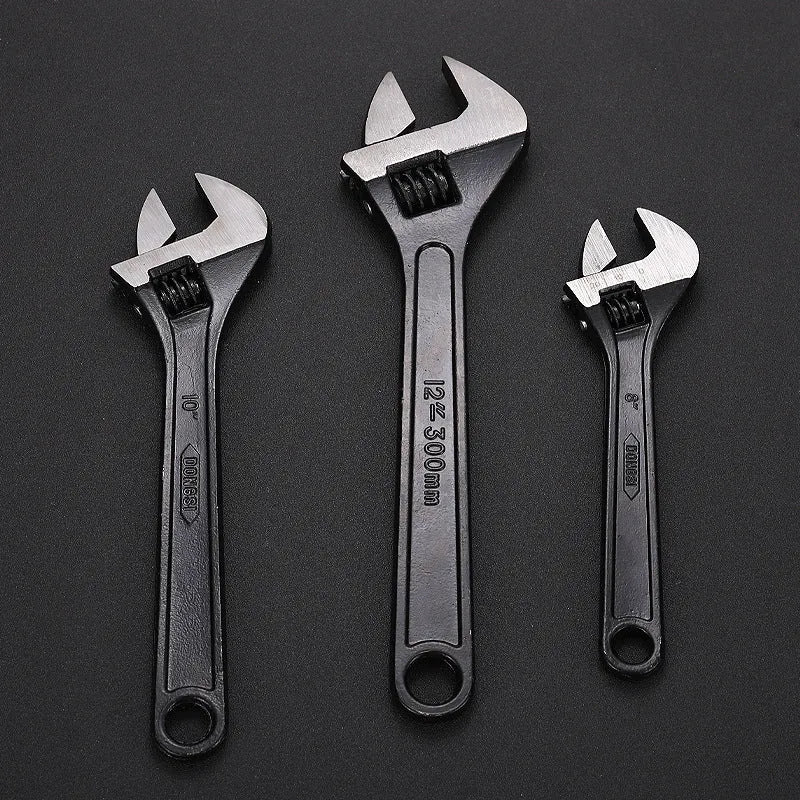 A black high carbon steel adjustable wrench on a white background, showing its open jaws and knurled adjustment screw.