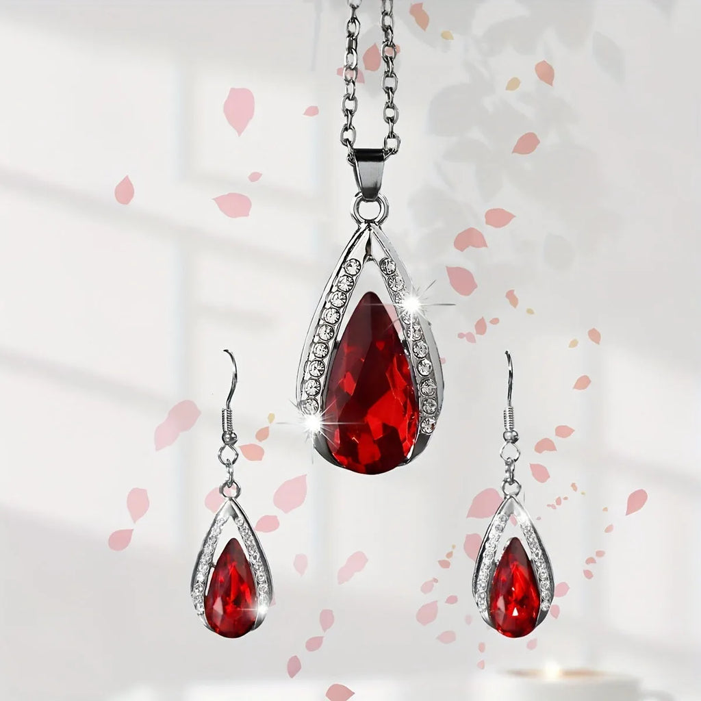 Alloy teardrop pendant necklace and matching earrings set in black or red finish.