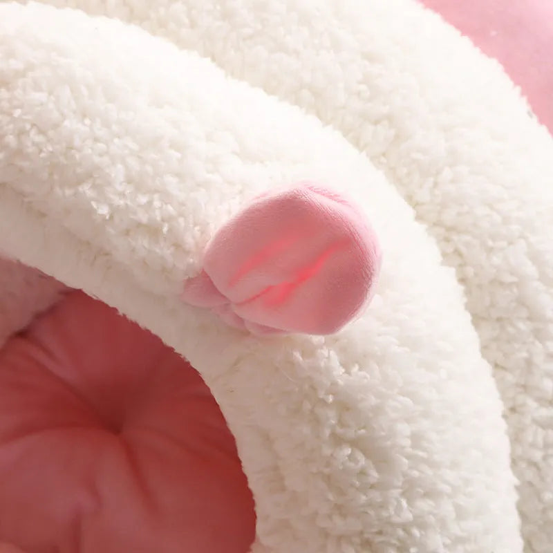 Blue enclosed cat nest with fluffy fleece interior, shown with a removable washable cover.