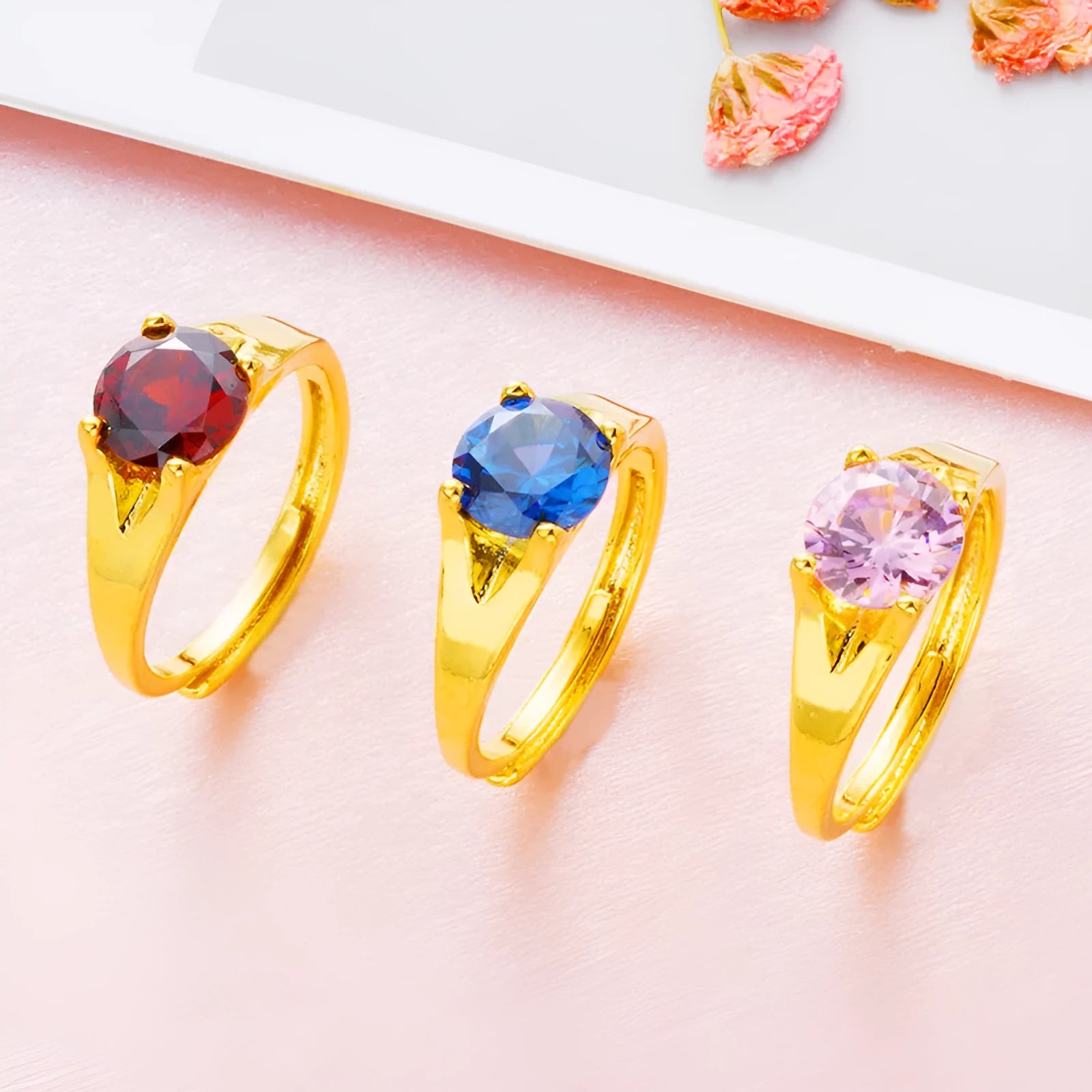 Women's adjustable copper ring with electroplated finish in one of six colours: black, blue, green, pink, red, or white.