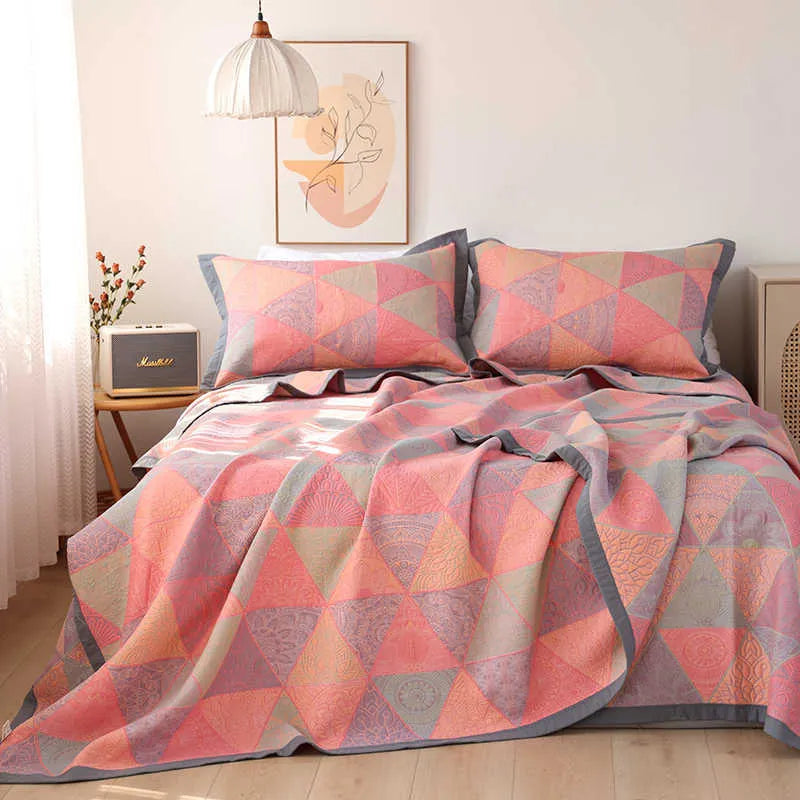 Three-piece cotton gauze bed blanket set with botanical floral pattern showing blanket and two pillowcases