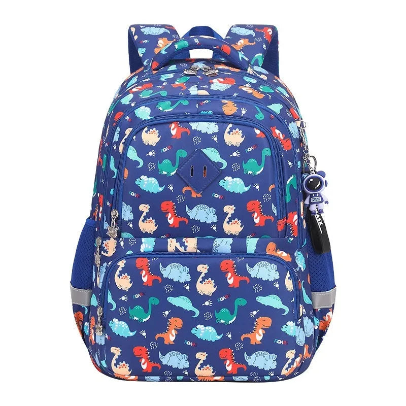Children's blue dinosaur print waterproof school backpack with curved straps on a white background.