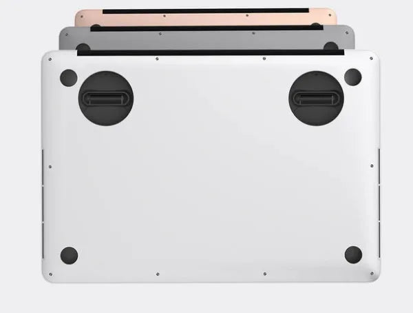 Two black ABS mini laptop stands on a desk, each 50x50x6.5mm, packaged as a 2-pack