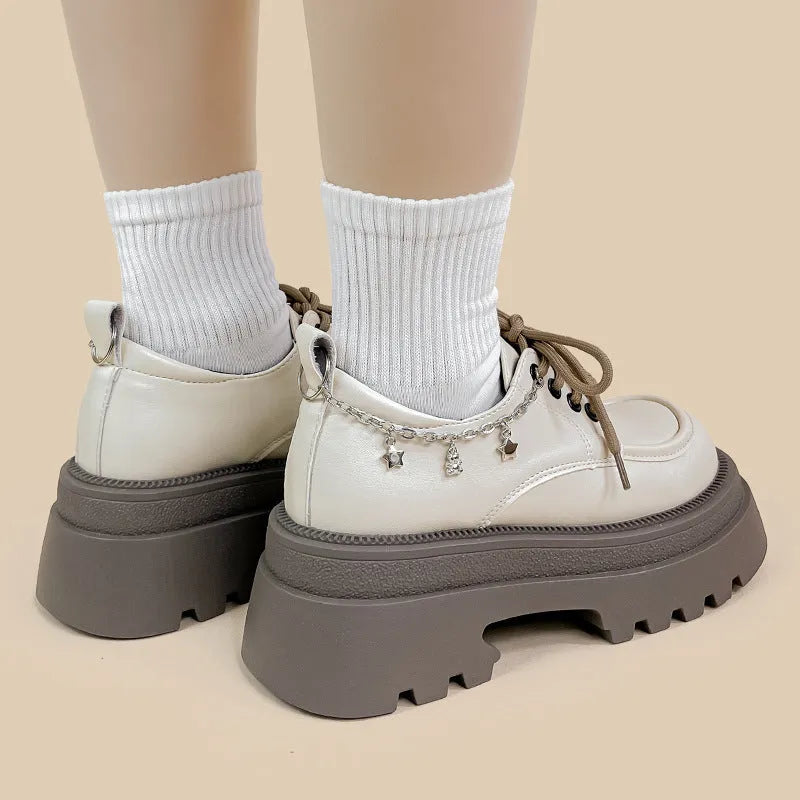 White platform leather shoes with chunky heel and round toe in British style