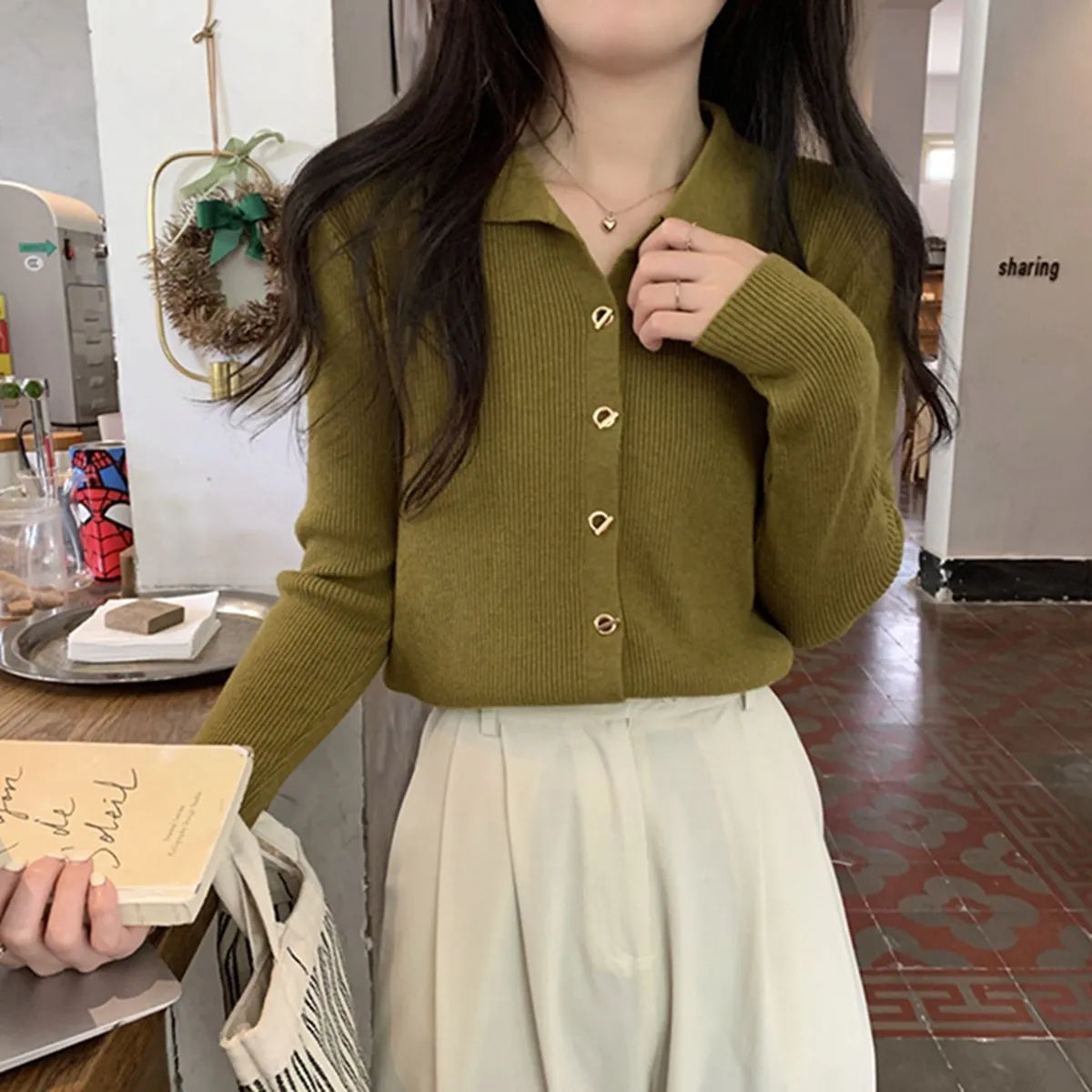 Long sleeve knitted cardigan in viscose fibre showing loose fit and available in beige, black, oatmeal, green, and khaki colours