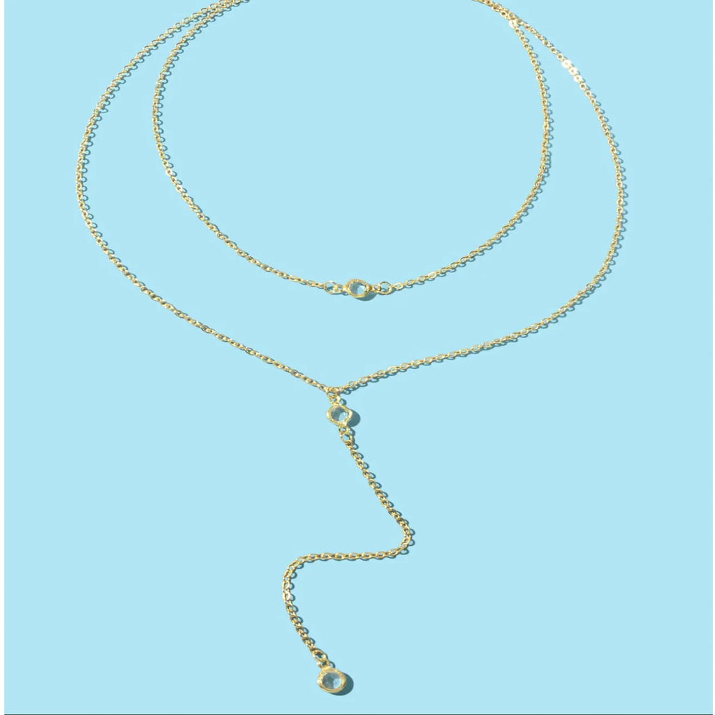 Alloy geometric pendant necklace with electroplated gold finish and O-ring chain on woman