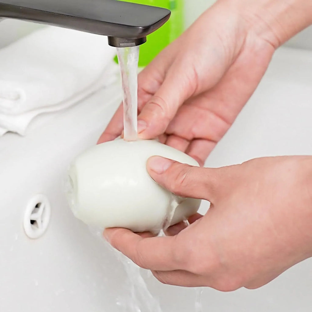 Green washable gel lint roller ball for pet hair removal from clothes and furniture