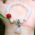 Hand-woven Chinese style agate bracelet with lotus seedpod beads and geometric design